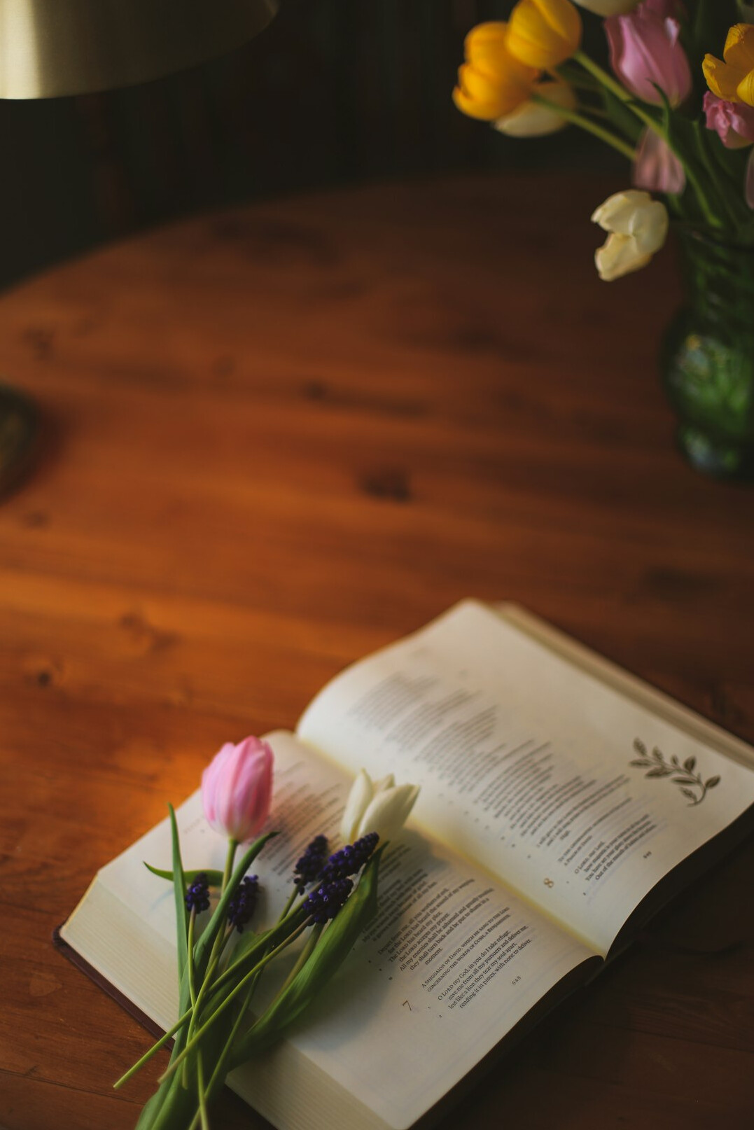 Open book and notes on a wooden table