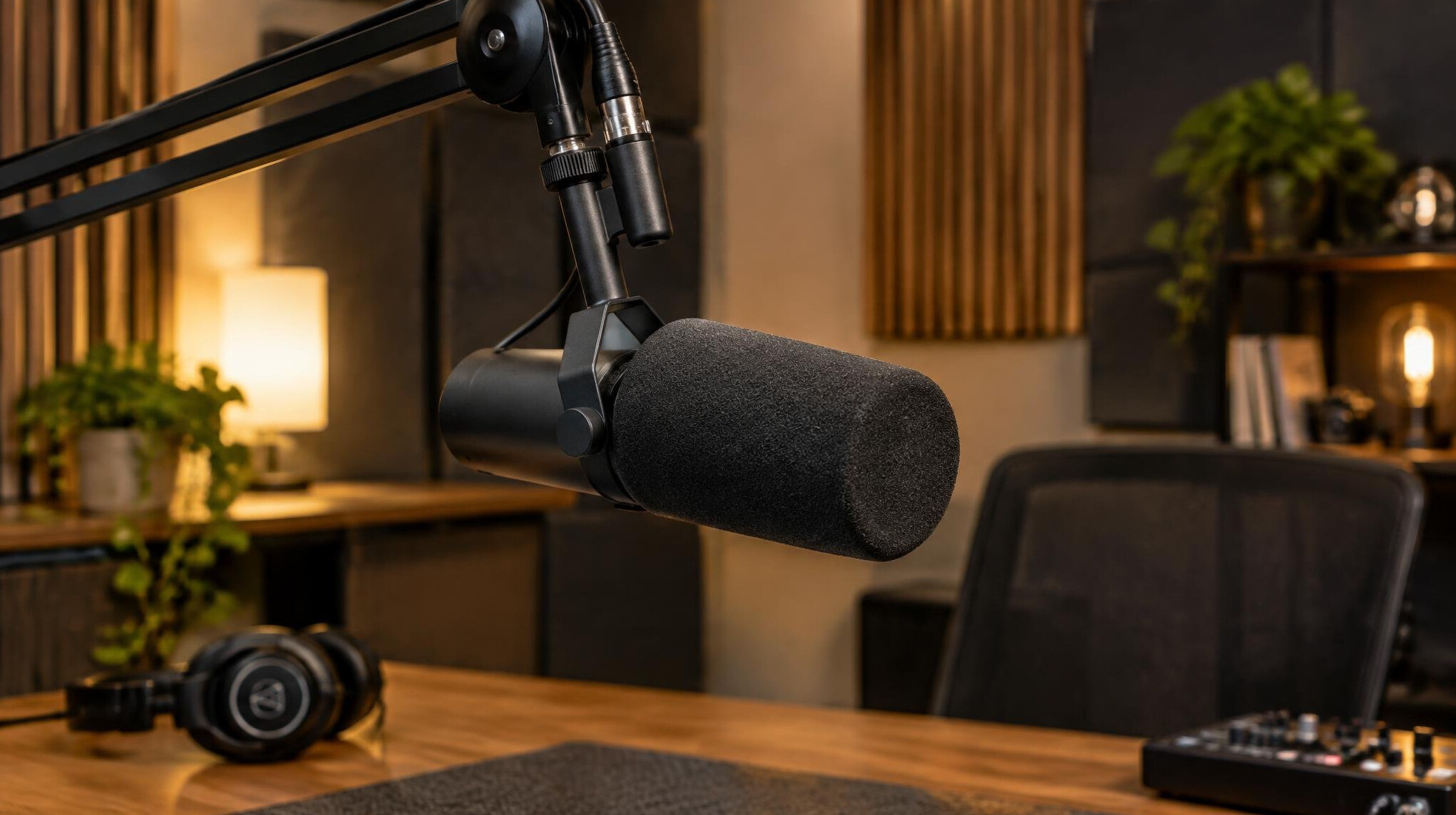 Professional podcast microphone in a quiet recording studio